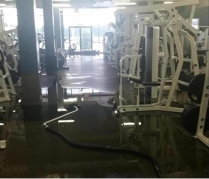 Gym with standing water on the floor