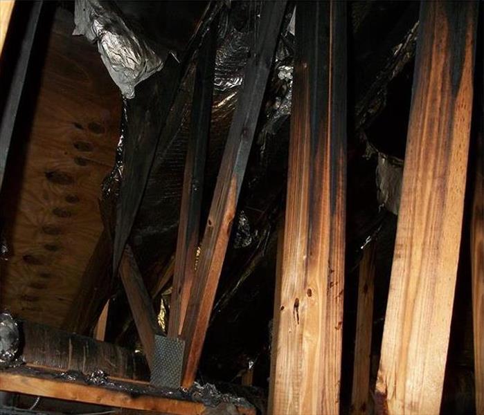 burnt rafters in an attic