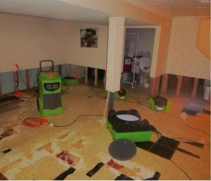 Basement with flood cuts and SERVPRO drying equipment