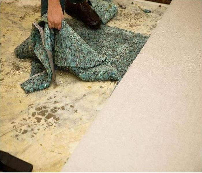 removing carpet padding from floor