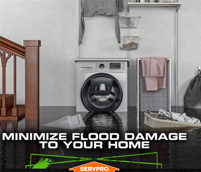 Flooded basement with standing water up to the washing machine and floating laundry basket.